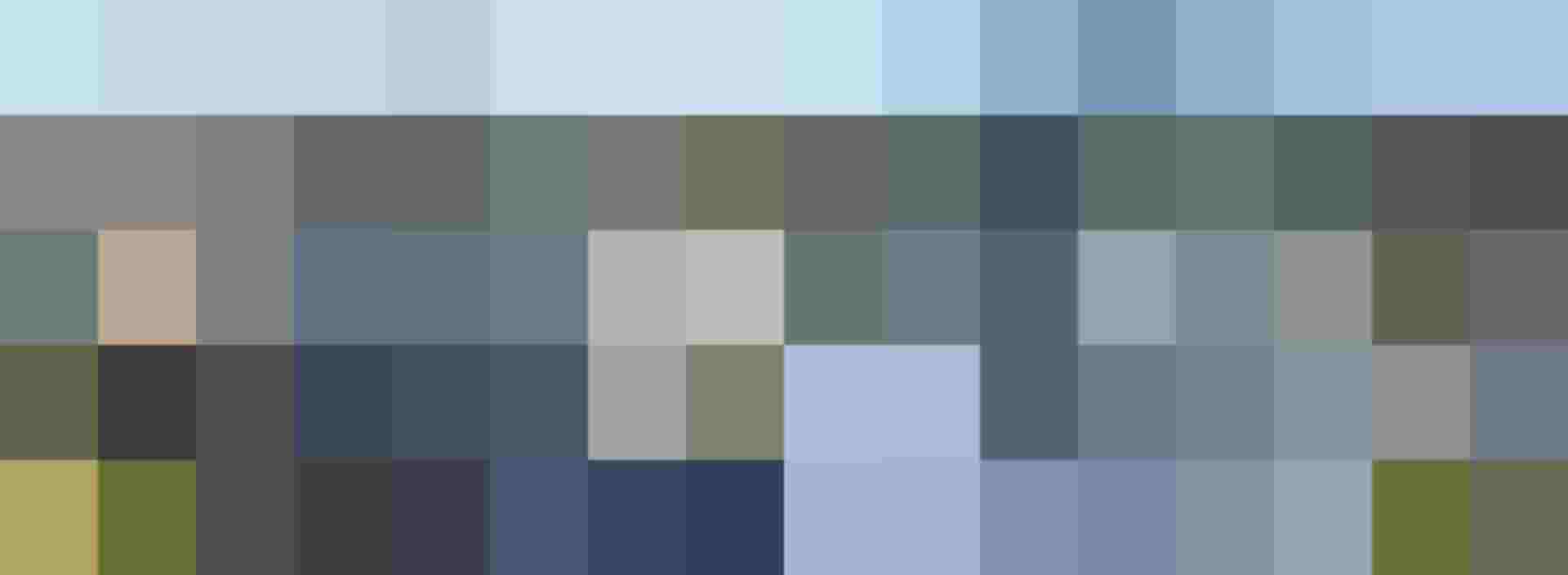 Moderne Wohnanlage mit mehreren Gebäuden und Bergpanorama